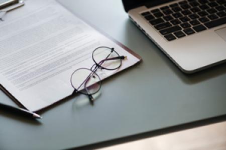 Photo of eyeglasses and computer